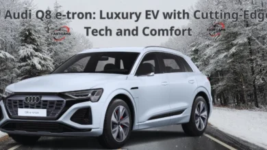 Audi Q8 e-tron SUV with sleek design and illuminated digital dashboard.