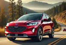 Red 2025 Ford Escape SUV on a highway, showing sporty design and sleek grille.